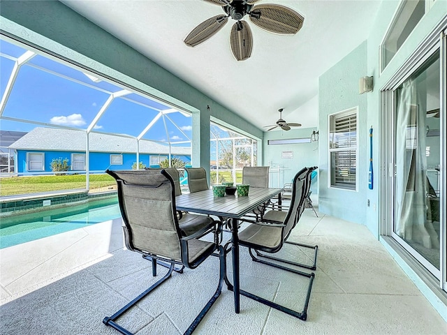 view of patio / terrace featuring glass enclosure and ceiling fan