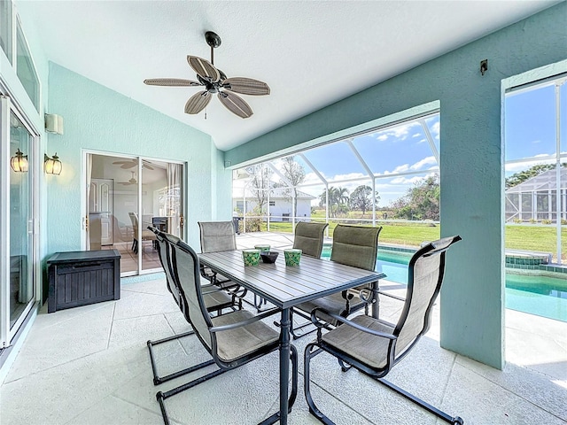 sunroom / solarium featuring ceiling fan