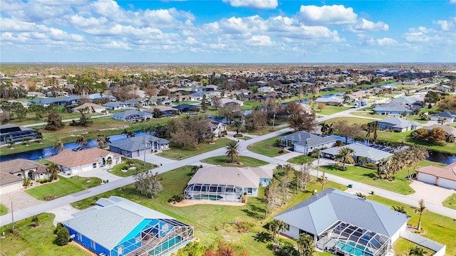 aerial view with a water view and a residential view