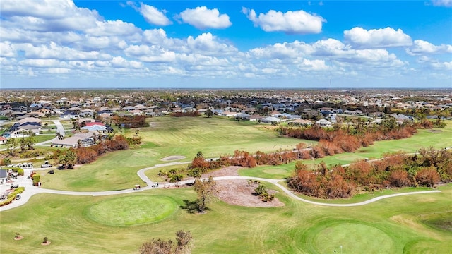 drone / aerial view with a residential view and view of golf course