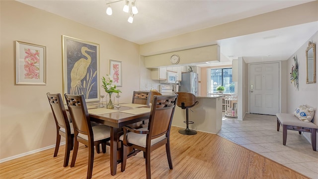 dining room featuring light hardwood / wood-style floors