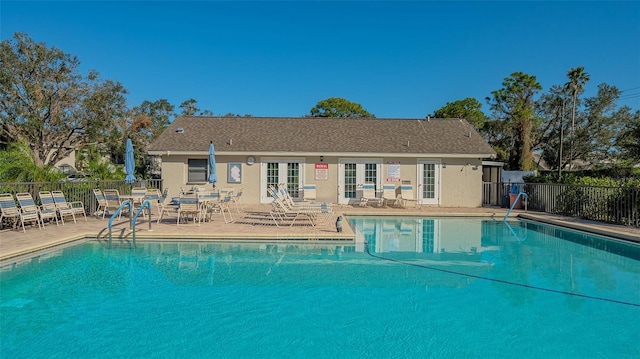 view of swimming pool with a patio area