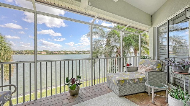 sunroom / solarium with a water view