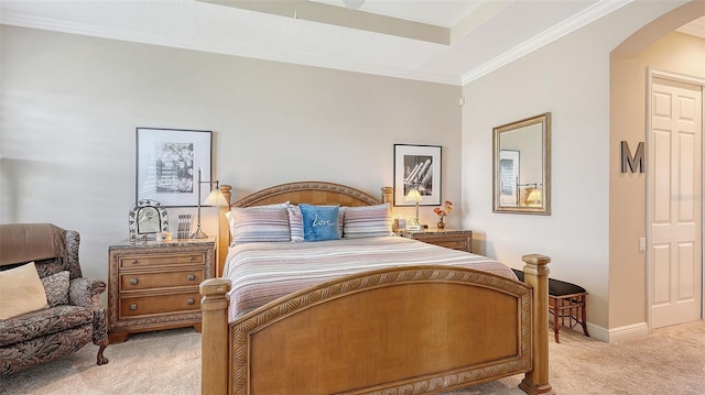 bedroom with light carpet and crown molding