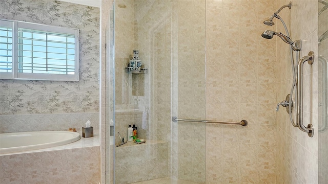 bathroom featuring separate shower and tub