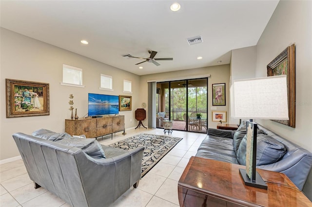 tiled living room with ceiling fan