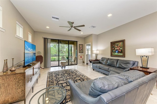 tiled living room with ceiling fan