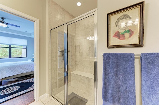 bathroom featuring wood-type flooring and a shower with door