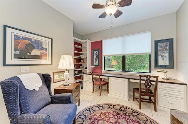 office area featuring built in desk, ceiling fan, and light tile patterned floors