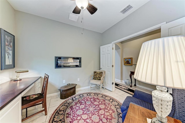 sitting room featuring light tile patterned flooring and ceiling fan