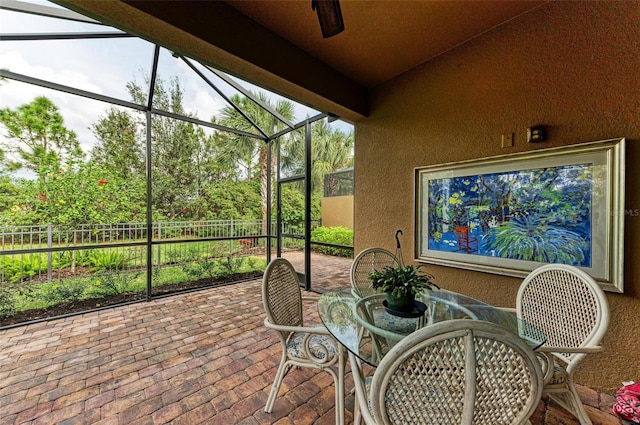 sunroom / solarium with lofted ceiling with beams