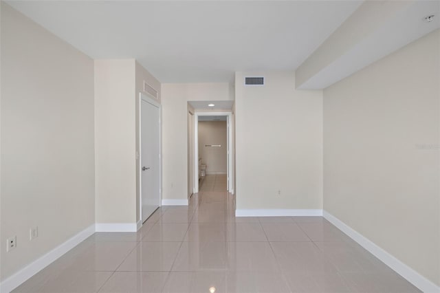 spare room with light tile patterned floors