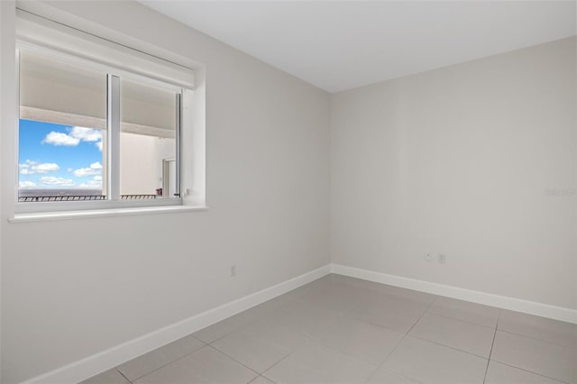 empty room with light tile patterned flooring