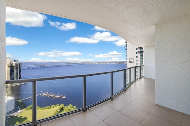 balcony featuring a water view