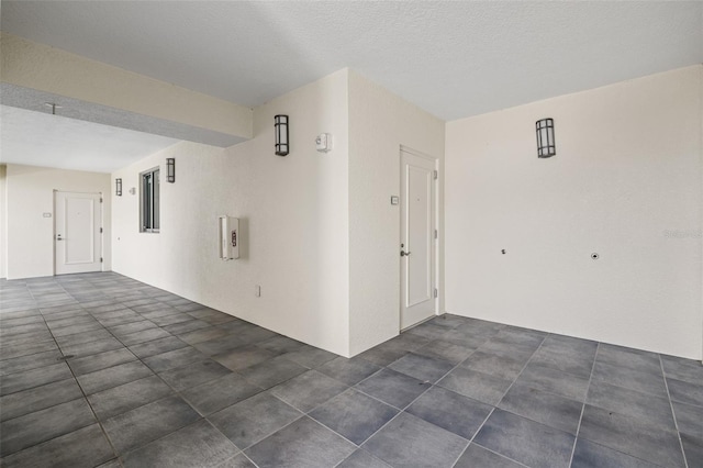 interior space with a textured ceiling