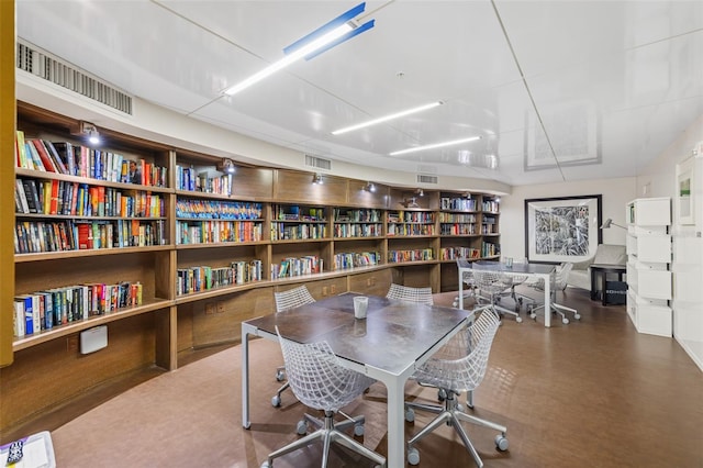 home office featuring concrete floors