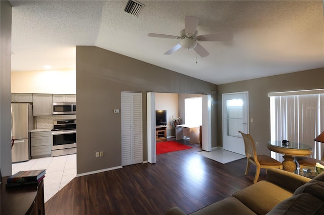 4105 33rd Avenue Dr W Unit 4105, Bradenton, FL 34205 - living area featuring lofted ceiling, visible vents, a ceiling fan, and light wood finished floors