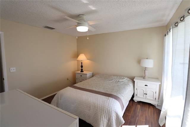 4105 33rd Avenue Dr W Unit 4105, Bradenton, FL 34205 - bedroom featuring dark wood-style floors, a textured ceiling, visible vents, and ceiling fan
