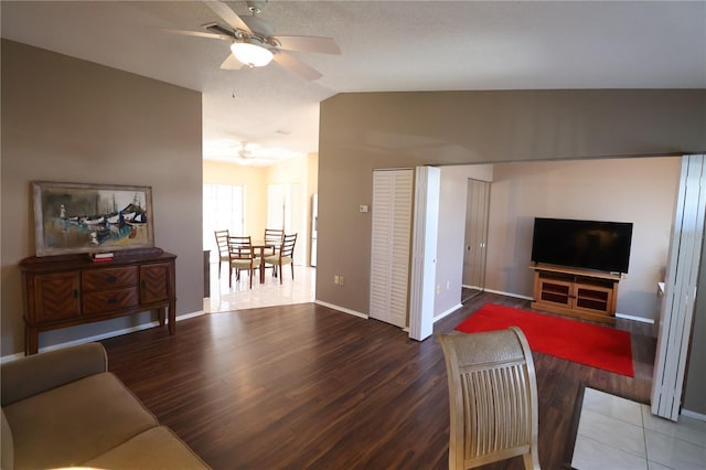 4105 33rd Avenue Dr W Unit 4105, Bradenton, FL 34205 - living room featuring baseboards, wood finished floors, ceiling fan, and lofted ceiling