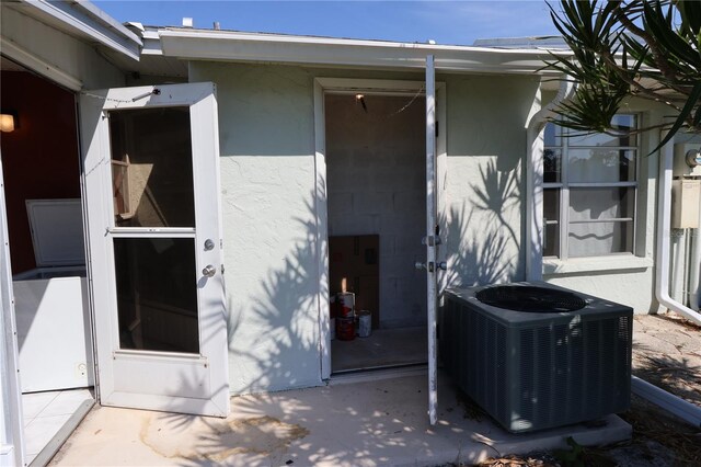 property entrance featuring central AC