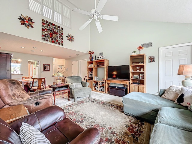 living room with high vaulted ceiling and ceiling fan