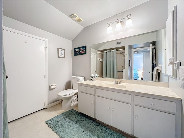 bathroom featuring toilet, curtained shower, vanity, and vaulted ceiling