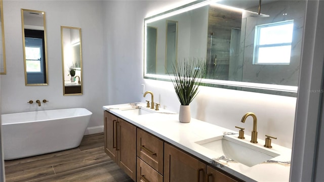 bathroom with vanity, separate shower and tub, wood-type flooring, and plenty of natural light