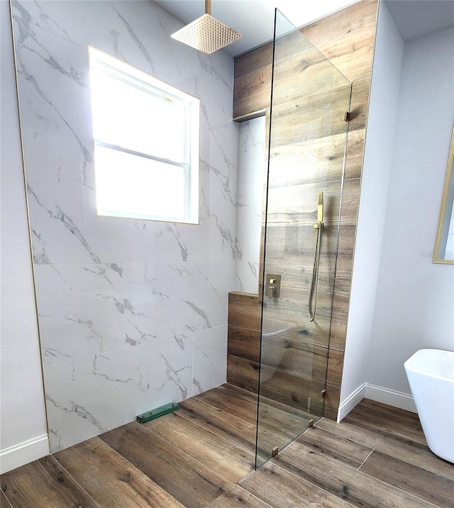 bathroom with separate shower and tub and hardwood / wood-style floors