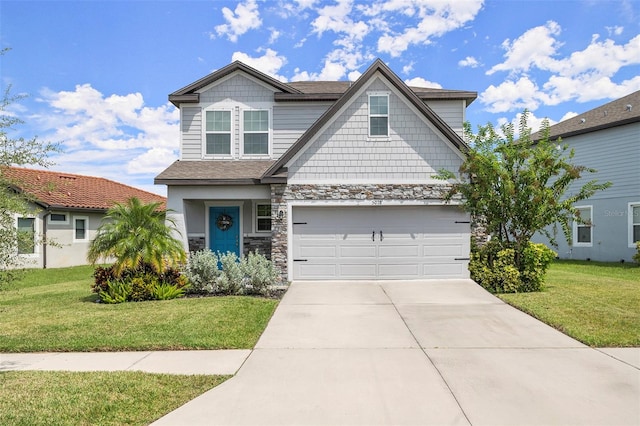 craftsman inspired home featuring a front yard and a garage