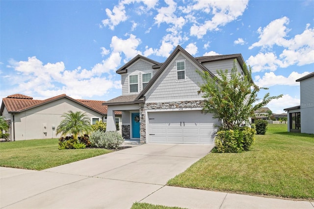 view of front of home with a front yard and a garage