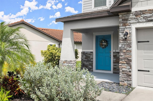 entrance to property featuring a garage