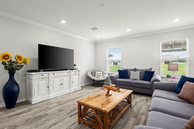 living room with crown molding and light wood-type flooring