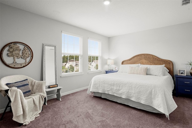 bedroom featuring dark colored carpet