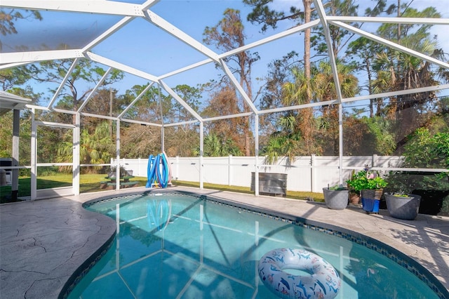 view of pool featuring a patio area and a lanai