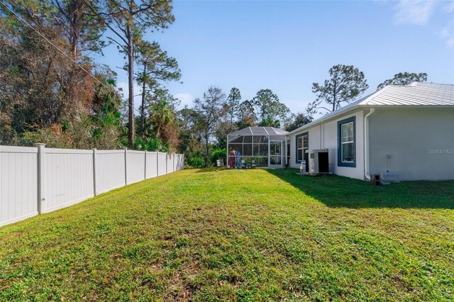 view of yard featuring a lanai