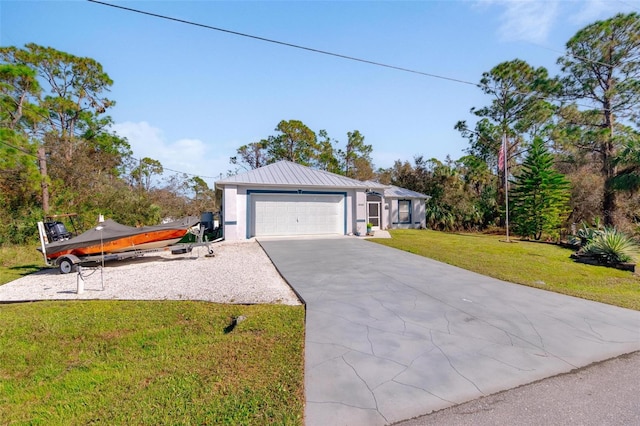 view of front facade with a front yard and a garage