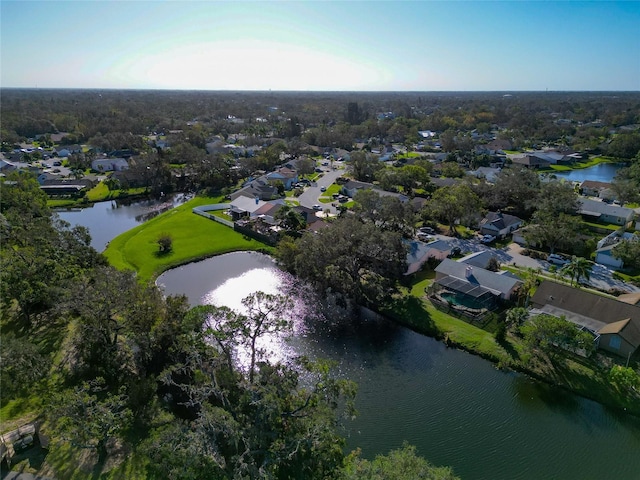 birds eye view of property with a water view and a residential view