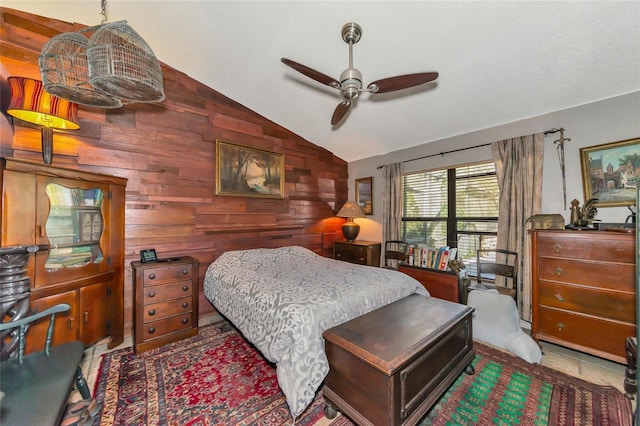 bedroom featuring tile patterned flooring, vaulted ceiling, and wood walls