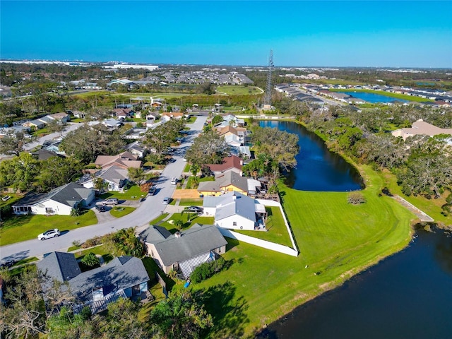 birds eye view of property with a residential view and a water view