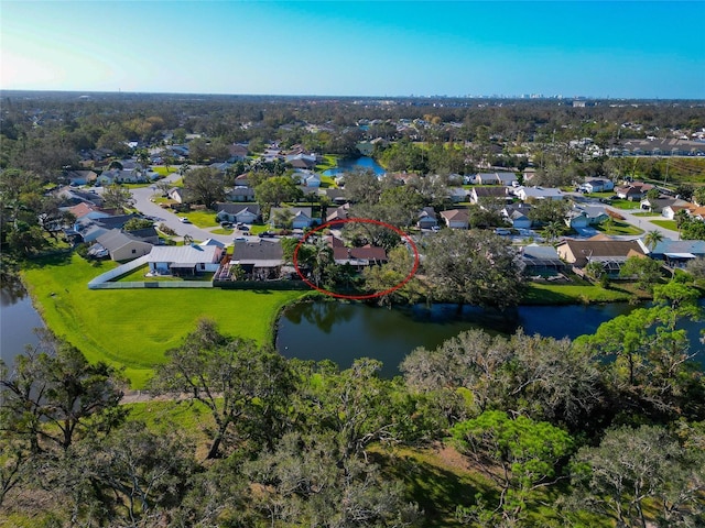 drone / aerial view featuring a residential view and a water view