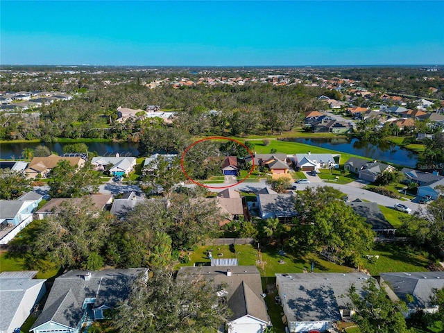 birds eye view of property featuring a residential view and a water view