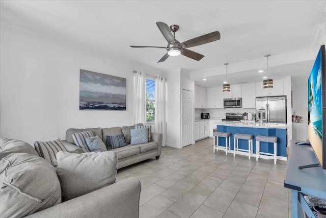 tiled living room with ceiling fan