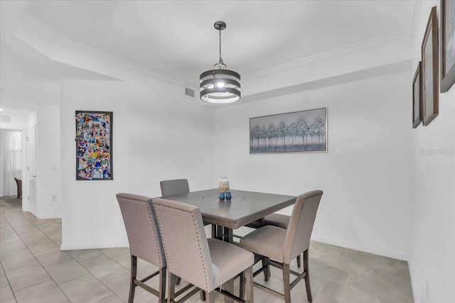 dining area featuring crown molding, a chandelier, and light tile patterned floors