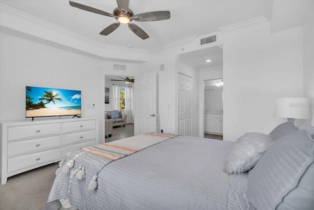 bedroom featuring crown molding, ensuite bathroom, and ceiling fan