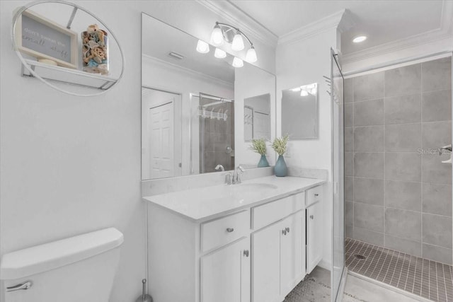 bathroom with toilet, ornamental molding, vanity, and tiled shower