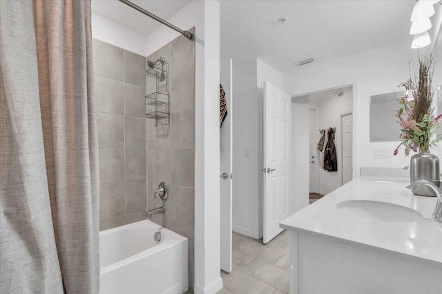 bathroom featuring vanity, shower / bathtub combination with curtain, and tile patterned flooring