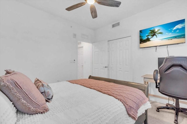 bedroom with a closet, carpet floors, and ceiling fan