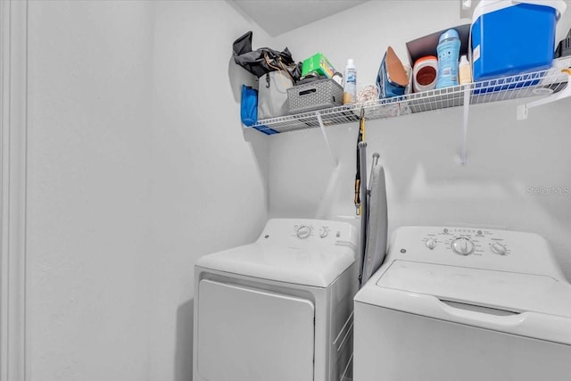 laundry room with independent washer and dryer