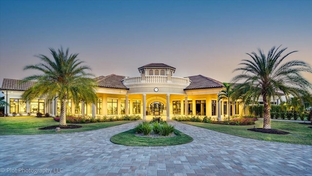 view of outdoor building at dusk