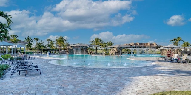 view of swimming pool featuring a patio and pool water feature